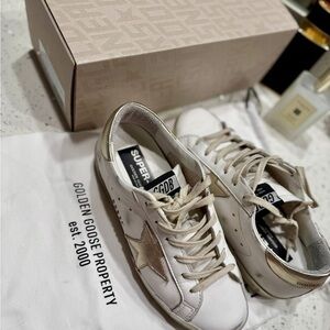 Golden Goose White and Gold Distressed Sneakers